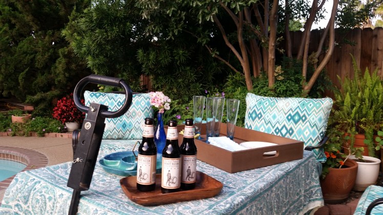 Garden table made from an old window and a garden cart.